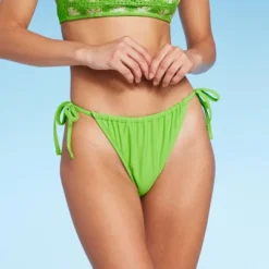 Women's Low-Rise Side-Tie Cheeky Bikini Bottom - Wild Fable™ -Wild Fable GUEST fb45f3d8 0545 4021 95ce 6cc80b70ceec
